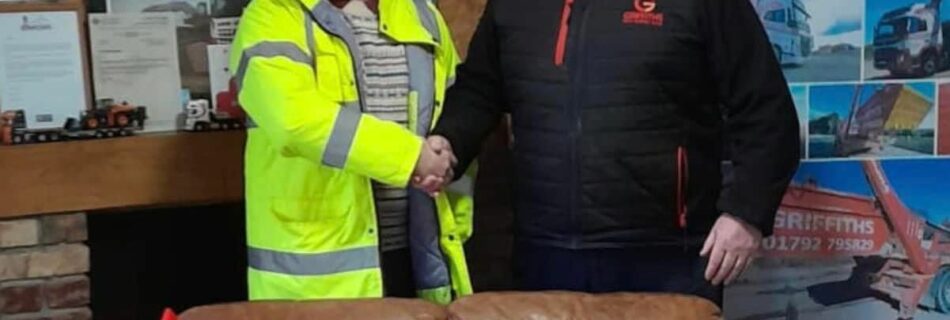 Thomas Plant hire business development manager delivering presents